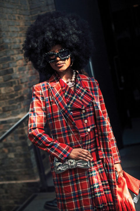 street style photo of a woman in a red plaid coat