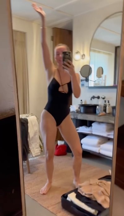 Julianne Hough wears black one-piece swimsuit